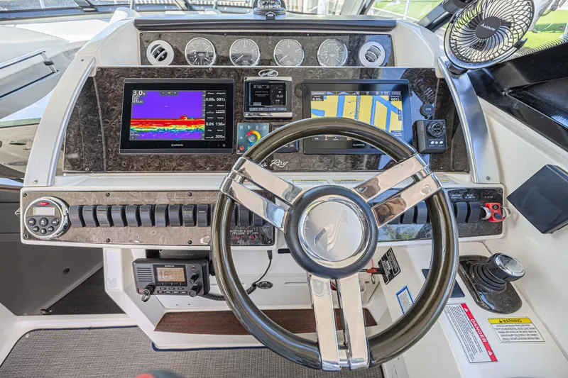 Slide: The Image of Cockpit of 2014 Sea Ray 410 Sundancer with advanced navigation and control systems. - 20
