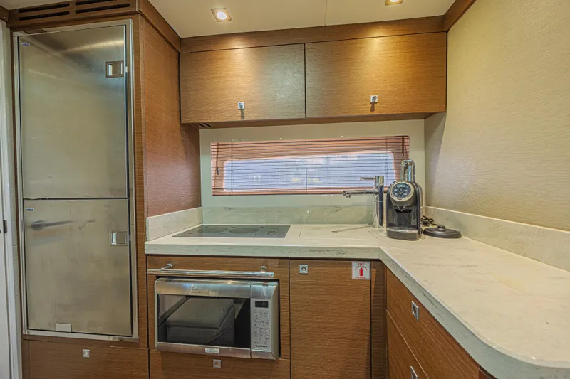 Slide: The Image of Luxurious kitchen interior of 2014 Sea Ray 410 Sundancer yacht with modern appliances. - 27