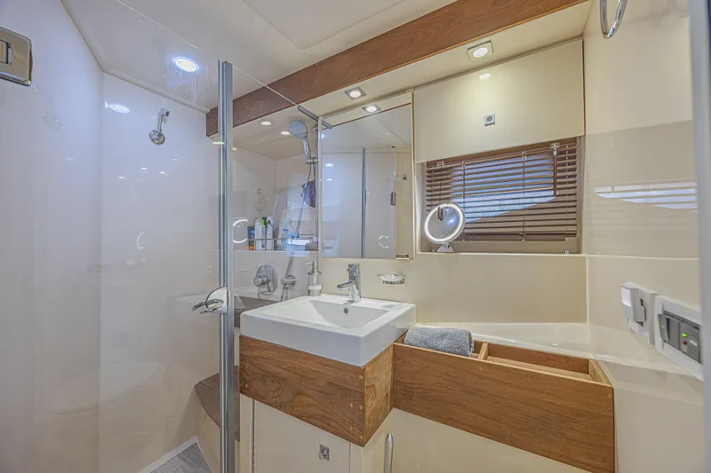 Slide: The Image of Luxurious bathroom interior of 2014 Sea Ray 410 Sundancer yacht with modern fixtures. - 32