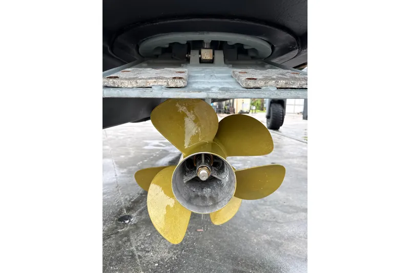 Slide: The Image of Close-up of a 2014 Sea Ray 410 Sundancer boat propeller on a wet surface. - 43