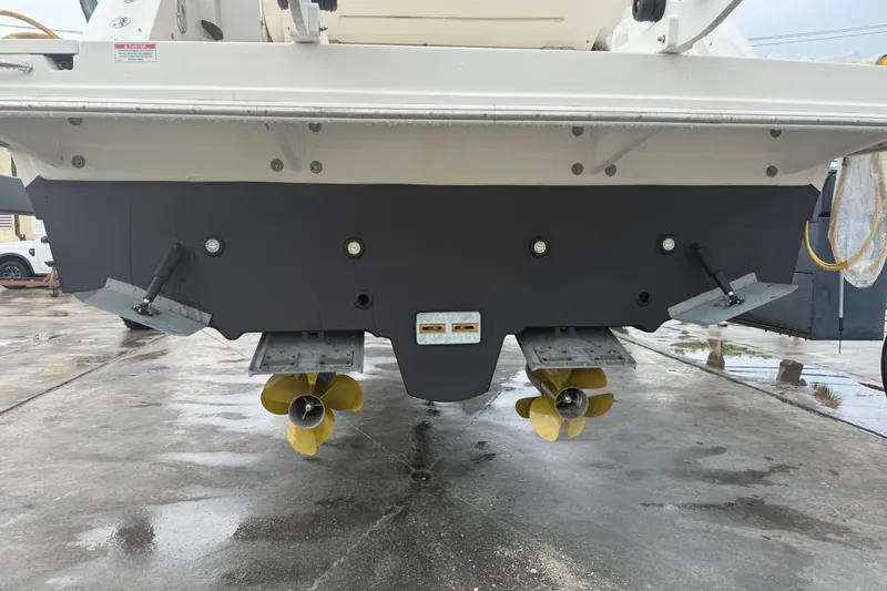 Slide: The Image of Rear view of a 2014 Sea Ray 410 Sundancer with dual propellers. - 40