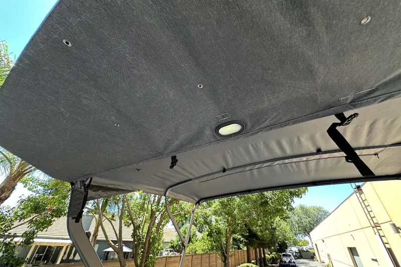 Slide: The Image of 2026 Sea-Doo Switch Fish 21 canopy, showcasing durable fabric and secure fastenings. - 23