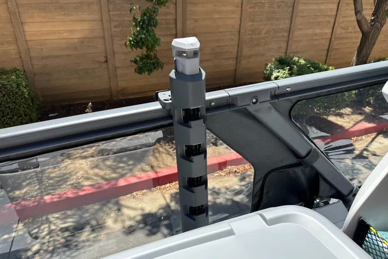 Slide: The Image of 2026 Sea-Doo Switch Fish 21 boat detail with rod holder and railing. - 19