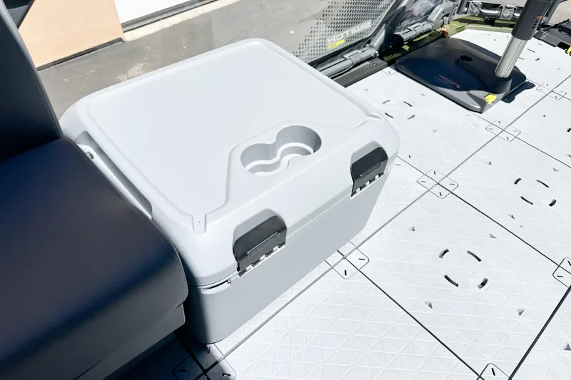 Slide: The Image of Cooler on 2026 Sea-Doo Switch Fish 21 deck, featuring secure latches and textured flooring. - 20