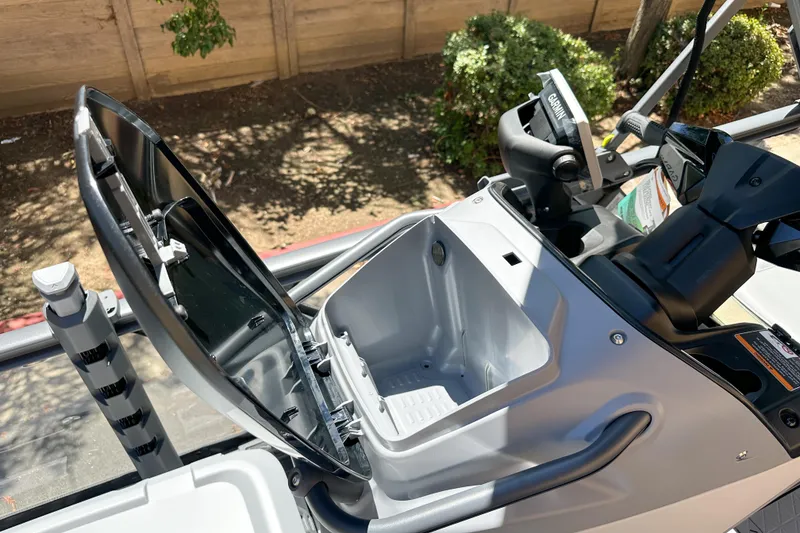 Slide: The Image of 2026 Sea-Doo Switch Fish 21 storage compartment with open lid, showcasing interior features. - 13