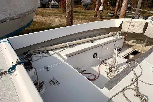 Slide: The Image of 1998 Alerion Express 20 sailboat deck with ropes and fittings. - 11