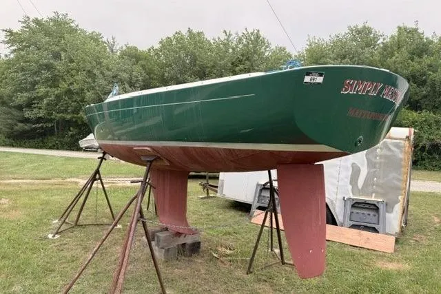 Slide: The Image of Alerion Express 20 sailboat, 1998 model, green hull, on stands in a grassy area. - 4