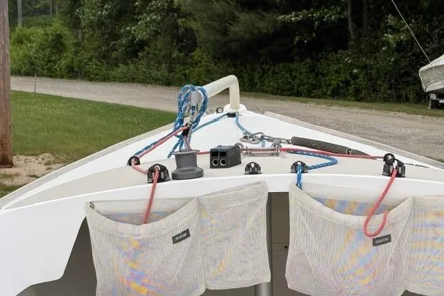 Slide: The Image of 1998 Alerion Express 20 sailboat deck with rigging and storage pouches. - 13