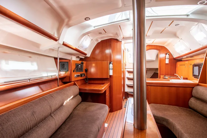 Slide: The Image of Interior of a Beneteau 343 yacht with wood finish and seating area. - 17