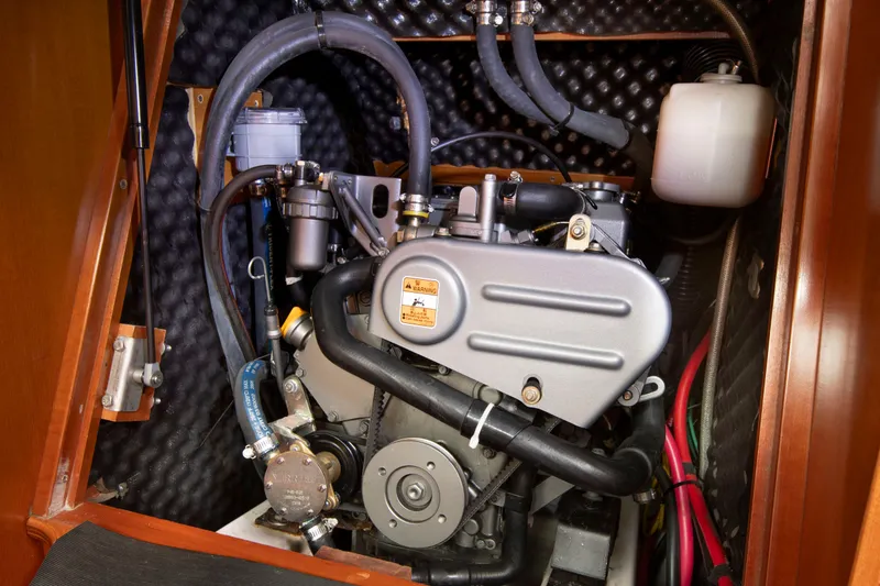 Slide: The Image of Engine compartment of a Beneteau 343 yacht with visible engine and hoses. - 24