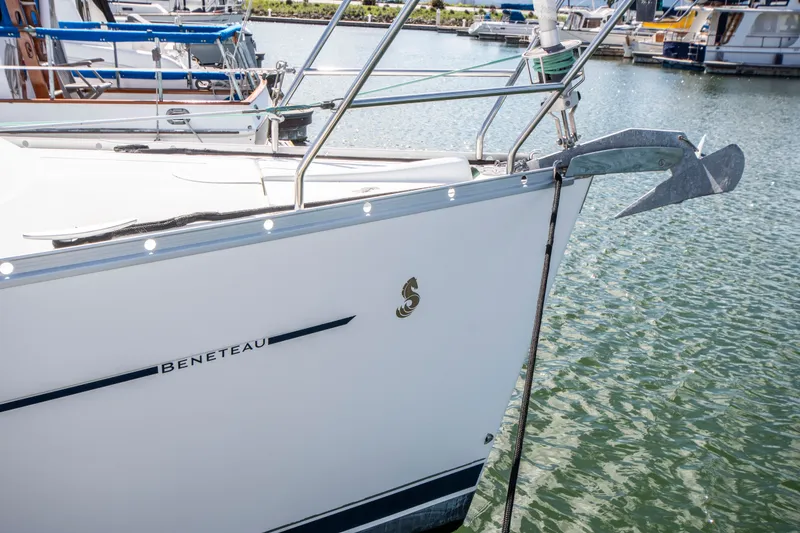 Slide: The Image of Close-up of the bow of a Beneteau 343, docked in the water. - 5