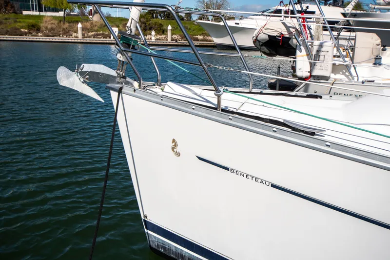 Slide: The Image of Close-up of the bow of a Beneteau 343, docked in the water. - 6