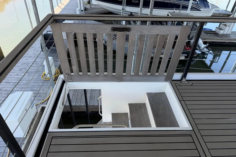 Slide: The Image of Staircase on 2022 Navisyo NV.08 yacht, featuring sleek wooden design and modern railing. - 13