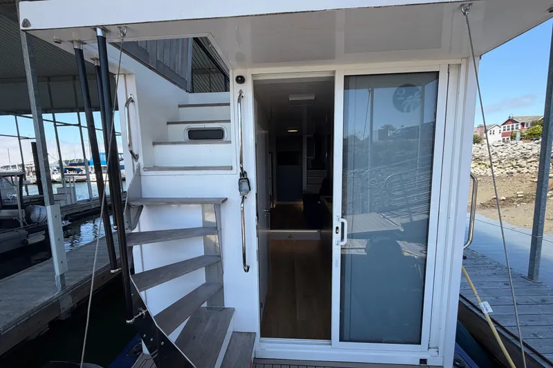 Slide: The Image of Navisyo NV.08 2022 model boat entrance with stairs and sliding glass door. - 16