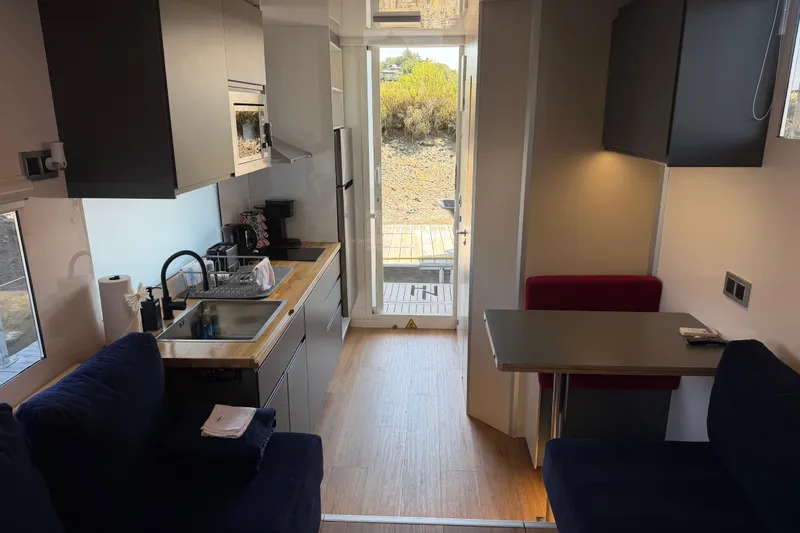 Slide: The Image of Modern interior of 2022 Navisyo NV.08 with kitchen and seating area. - 17