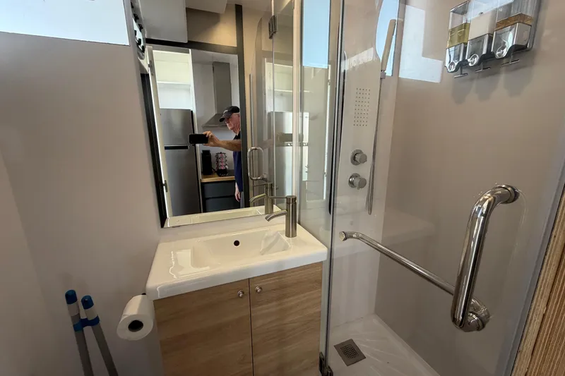 Slide: The Image of Modern bathroom in 2022 Navisyo NV.08 with shower, sink, and storage. - 20