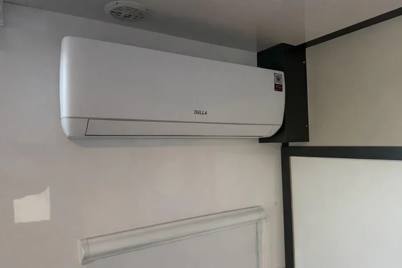 Slide: The Image of Wall-mounted air conditioning unit inside Navisyo NV.08, 2022 model, with sleek design. - 23