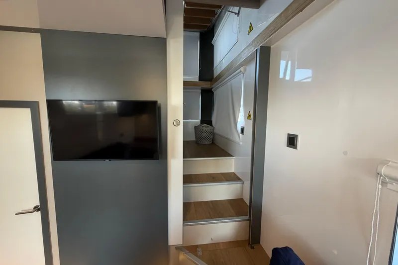 Slide: The Image of Modern interior of 2022 Navisyo NV.08 with sleek staircase and wall-mounted TV. - 24