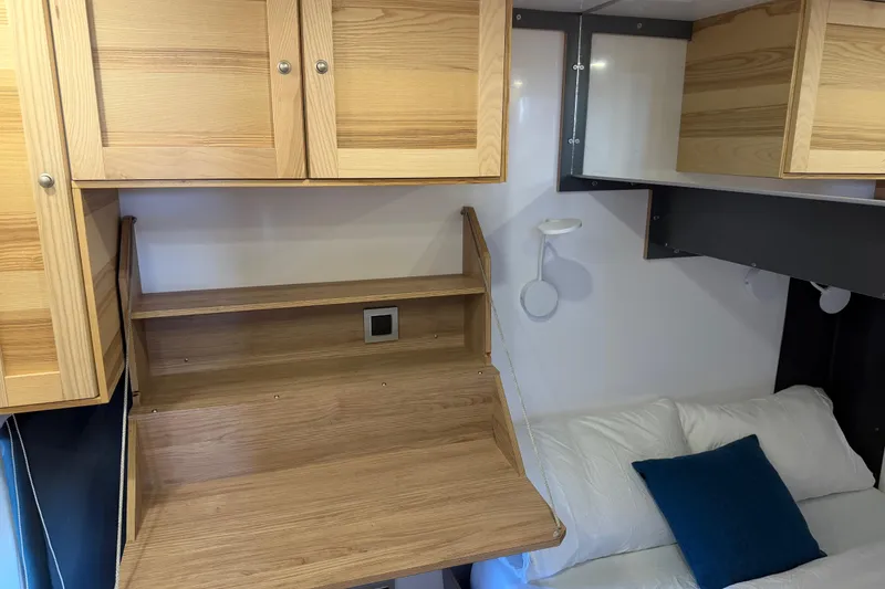 Slide: The Image of Compact interior of 2022 Navisyo NV.08 with wooden cabinets and foldable desk. - 28
