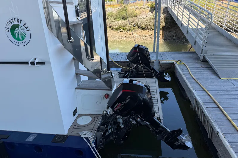 Slide: The Image of Navisyo NV.08 2022 boat docked at Discovery Bay Floatel with dual outboard motors. - 6