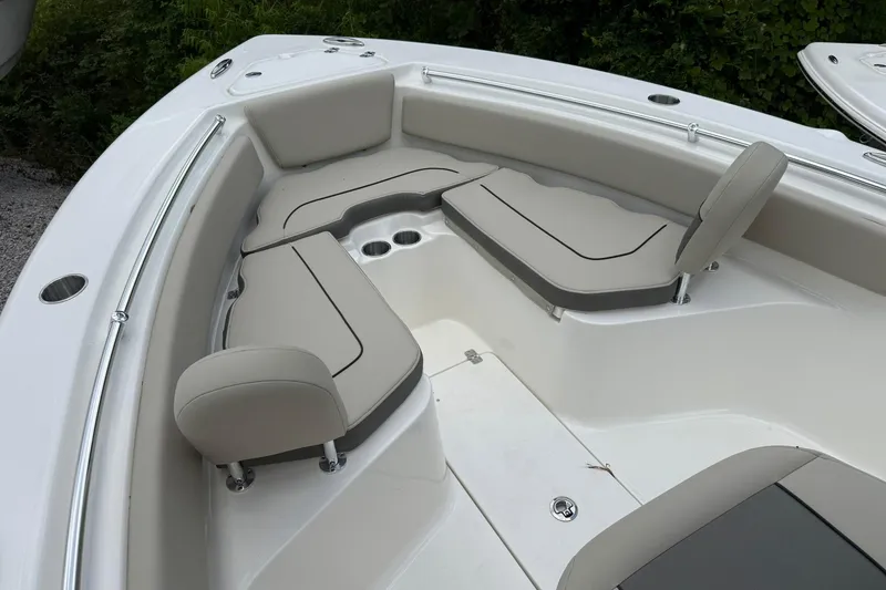 Slide: The Image of 2026 Key West 239 FS boat interior with cushioned seating and cup holders. - 4