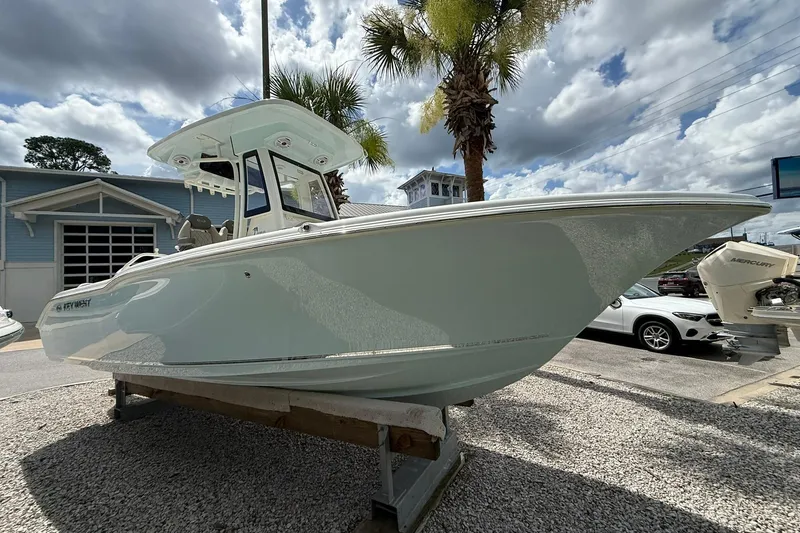 Slide: The Image of 2026 Key West 239 FS boat displayed outdoors under cloudy sky. - 1