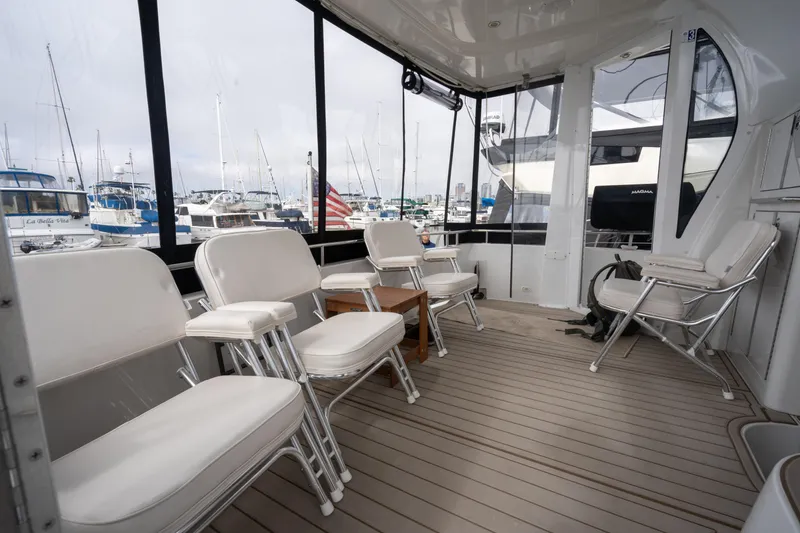 Slide: The Image of Interior of 2001 Carver 396 Motor Yacht with white seating. - 10