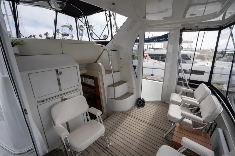 Slide: The Image of Interior of 2001 Carver 396 Motor Yacht with seating area. - 12