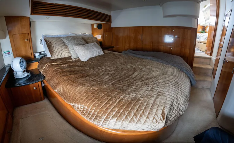 Slide: The Image of Luxurious bedroom in a 2001 Carver 396 Motor Yacht. - 14