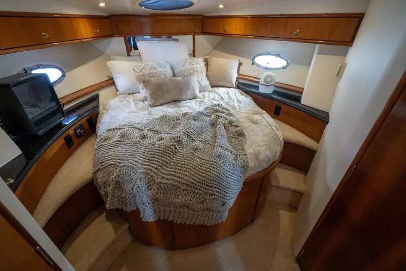 Slide: The Image of Luxurious bedroom in a 2001 Carver 396 Motor Yacht. - 16