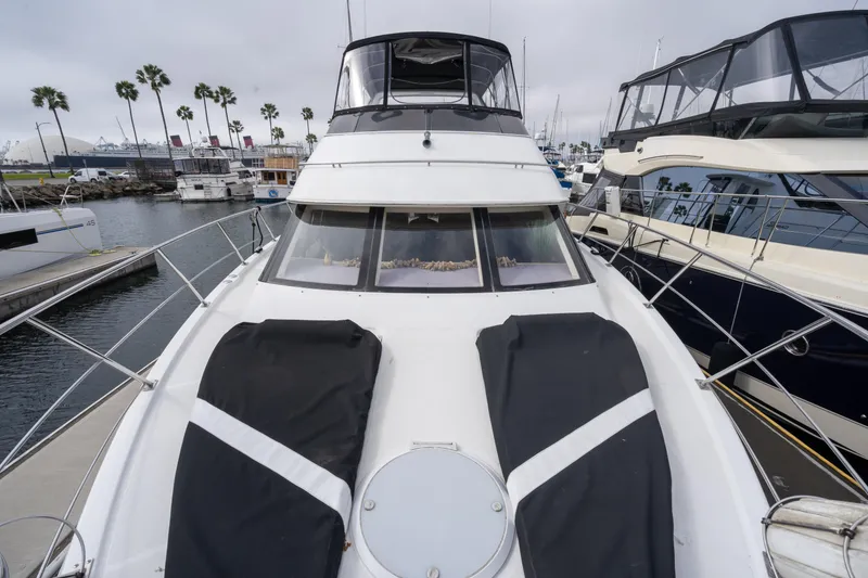 Slide: The Image of 2001 Carver 396 Motor Yacht docked, front view. - 2