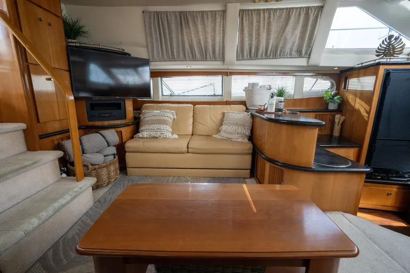 Slide: The Image of Interior of 2001 Carver 396 Motor Yacht with sofa and TV. - 22