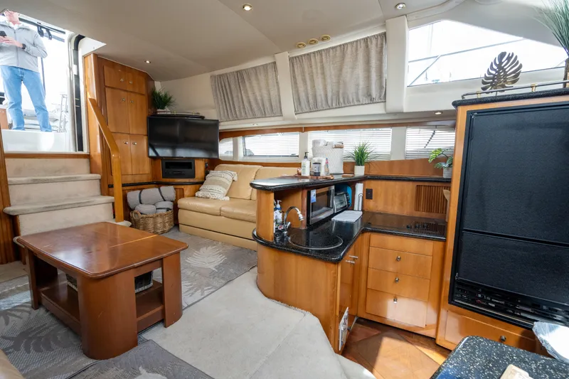 Slide: The Image of Interior of 2001 Carver 396 Motor Yacht with sofa and kitchen. - 23