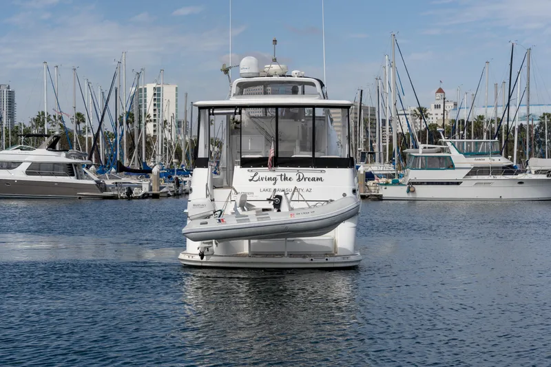 Slide: The Image of 2001 Carver 396 Motor Yacht in harbor, surrounded by sailboats. - 25