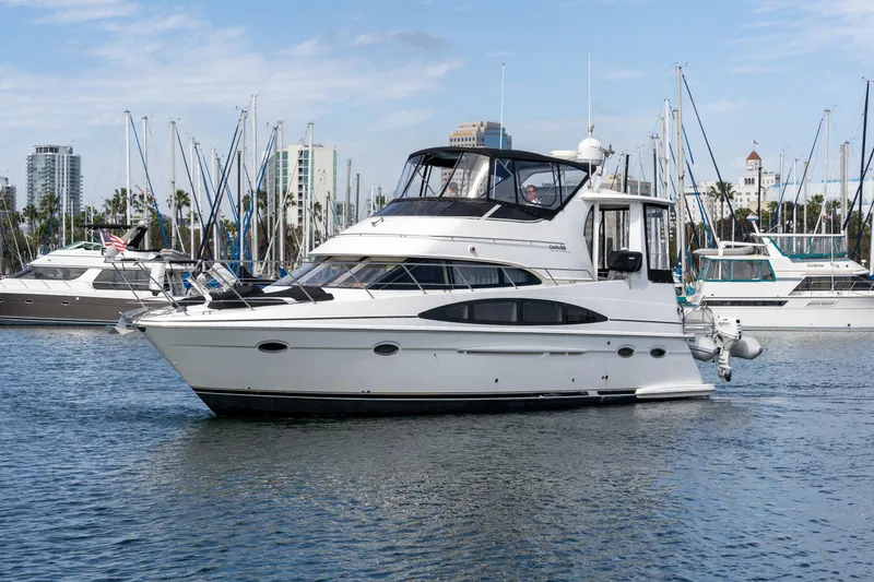 Slide: The Image of 2001 Carver 396 Motor Yacht in harbor, surrounded by other boats. - 27