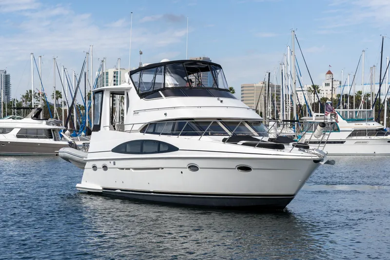 Slide: The Image of 2001 Carver 396 Motor Yacht in harbor, surrounded by other boats. - 28