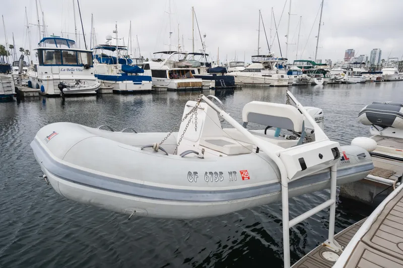 Slide: The Image of Carver 396 Motor Yacht 2001 in harbor with dinghy. - 29
