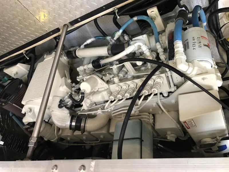 Slide: The Image of Engine room of 2001 Carver 396 Motor Yacht, showcasing complex piping. - 32
