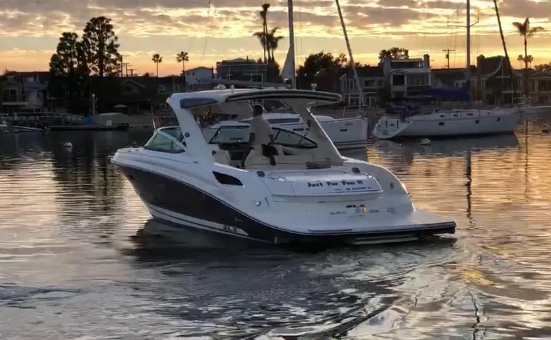 Slide: The Image of 2015 Sea Ray SLX 350 boat at sunset in harbor. - 1