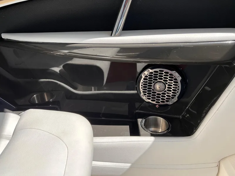 Slide: The Image of Interior of 2015 Sea Ray SLX 350 with speaker and cup holders. - 21