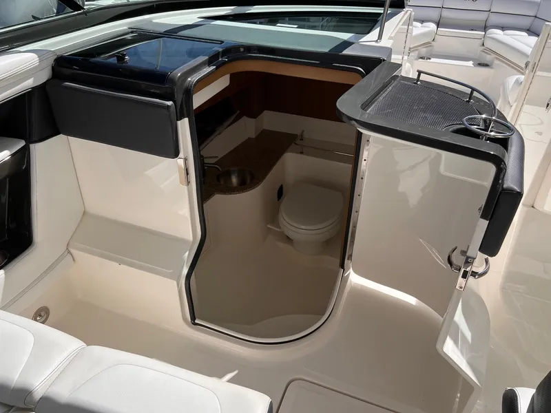 Slide: The Image of Interior of a 2015 Sea Ray SLX 350 with toilet. - 22