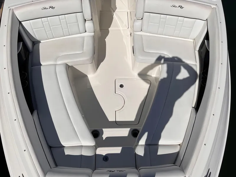 Slide: The Image of Interior of a 2015 Sea Ray SLX 350 boat with white seating. - 26