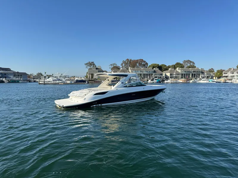 Slide: The Image of 2015 Sea Ray SLX 350 anchored on calm waters. - 9