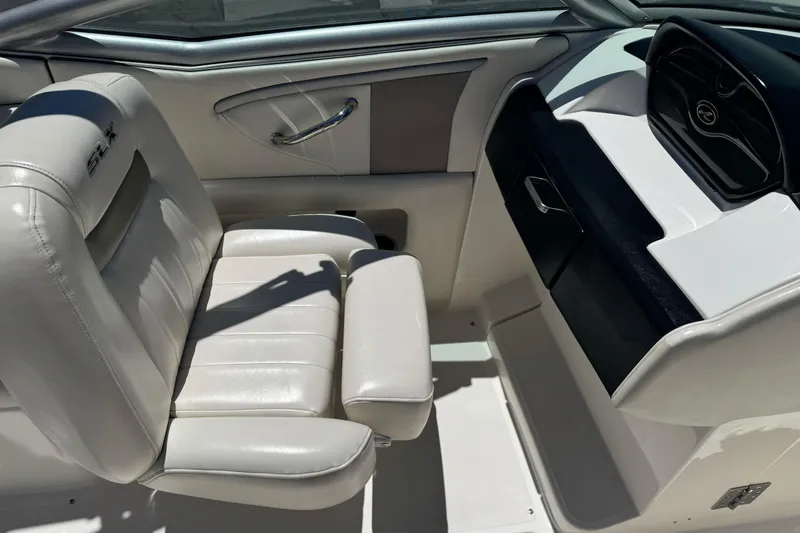 Slide: The Image of Interior of a 2007 Sea Ray SLX 250 boat with white leather seating. - 16