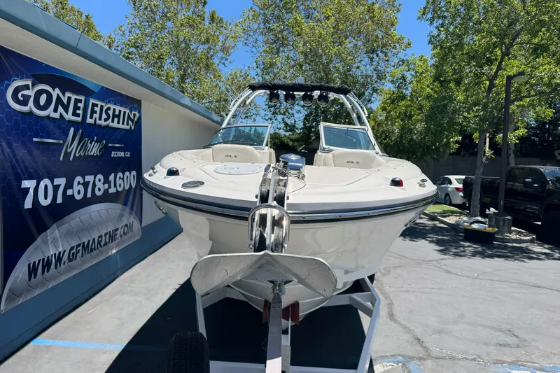 Slide: The Image of 2007 Sea Ray SLX 250 boat displayed at Gone Fishin' Marine dealership. - 2