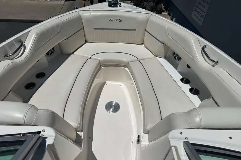 Slide: The Image of Luxurious seating area on a 2007 Sea Ray SLX 250 boat, featuring white upholstery. - 23