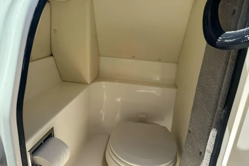 Slide: The Image of 2007 Sea Ray SLX 250 boat interior with compact marine toilet. - 36