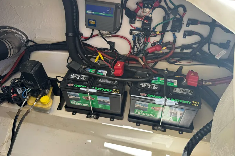 Slide: The Image of Engine compartment of a 2007 Sea Ray SLX 250 with marine batteries and wiring. - 40