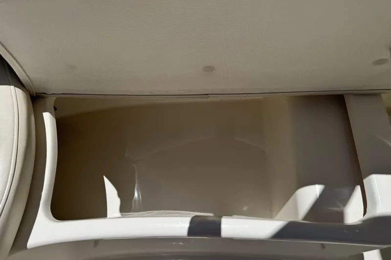 Slide: The Image of Storage compartment in a 2007 Sea Ray SLX 250 boat, featuring clean interior space. - 41