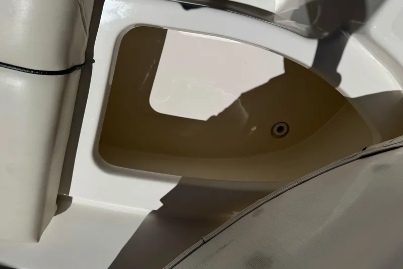 Slide: The Image of Storage compartment in a 2007 Sea Ray SLX 250 boat, featuring white interior. - 42